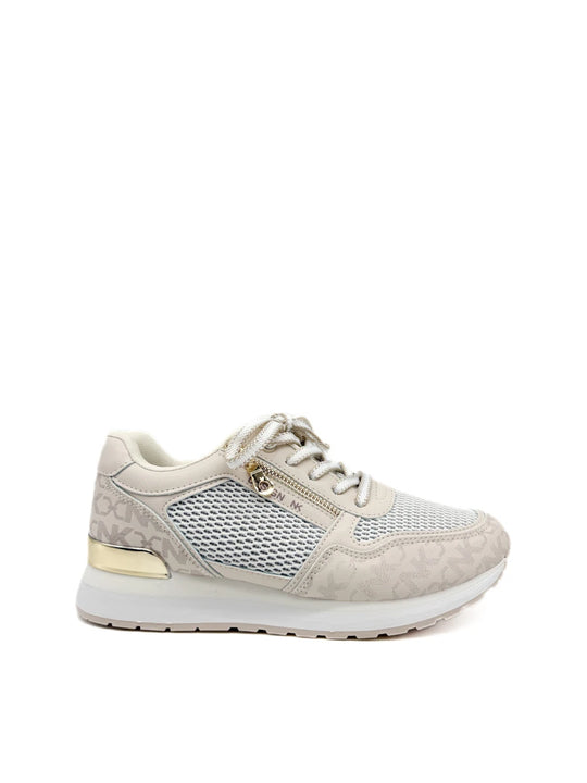 Zapatillas beige con cremallera lateral dorada.