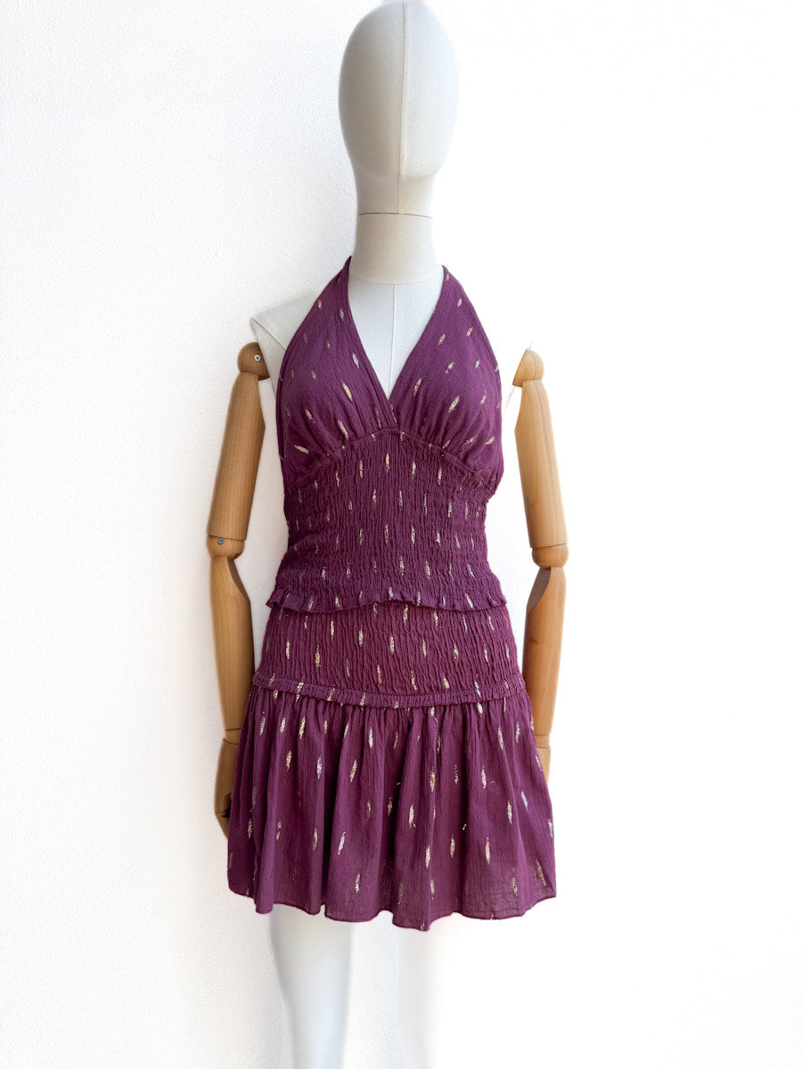 Conjunto halter de top smock y falda pantalón con detalles dorados