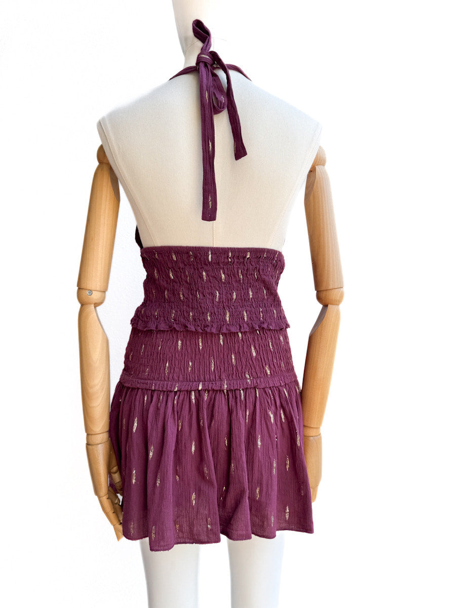 Conjunto halter de top smock y falda pantalón con detalles dorados