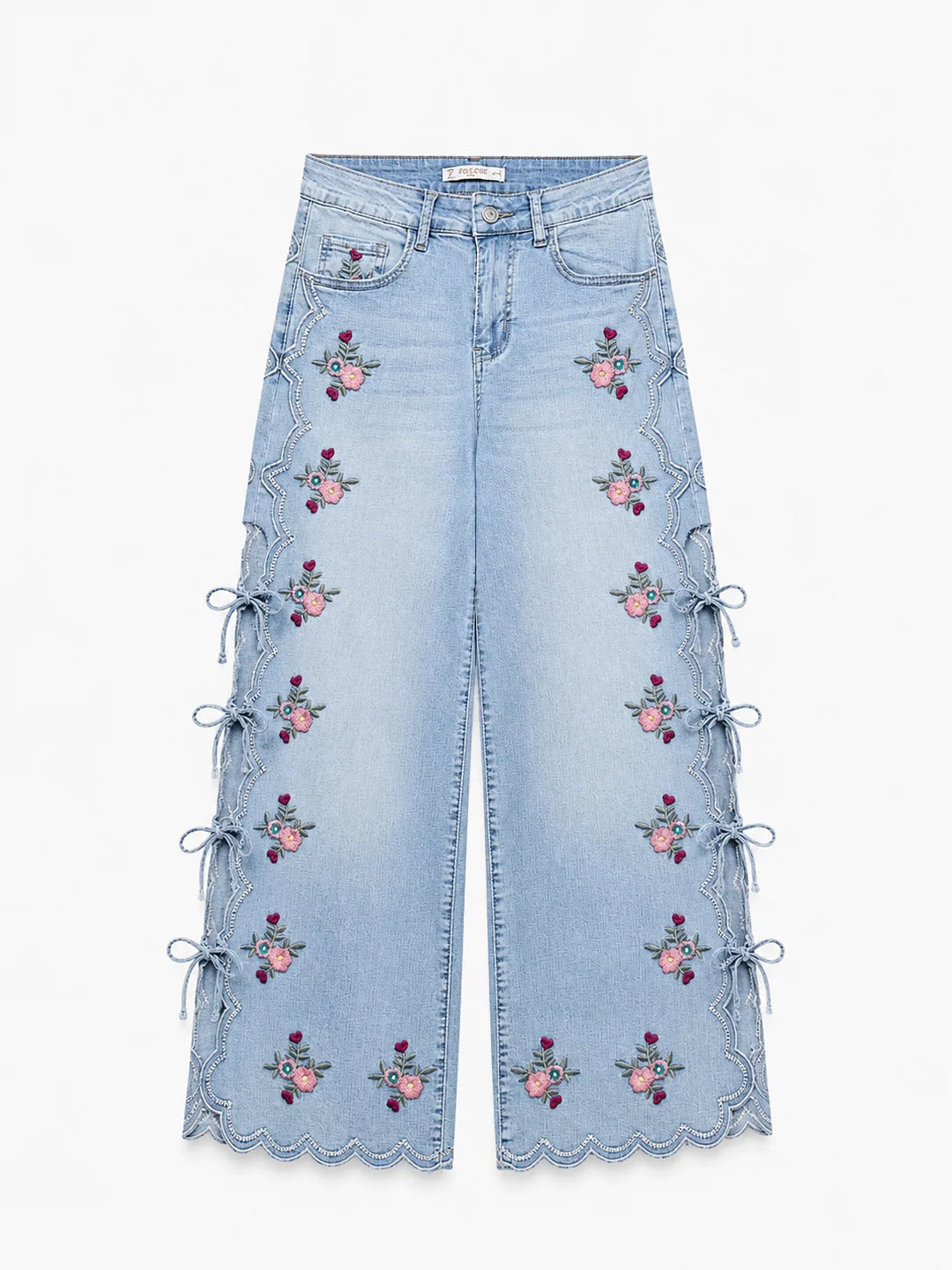Jeans wide leg con bordado floral y aberturas laterales