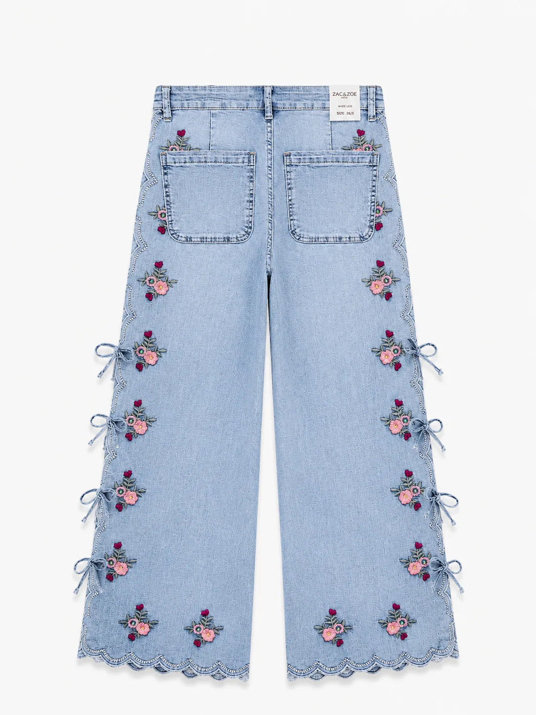 Jeans wide leg con bordado floral y aberturas laterales