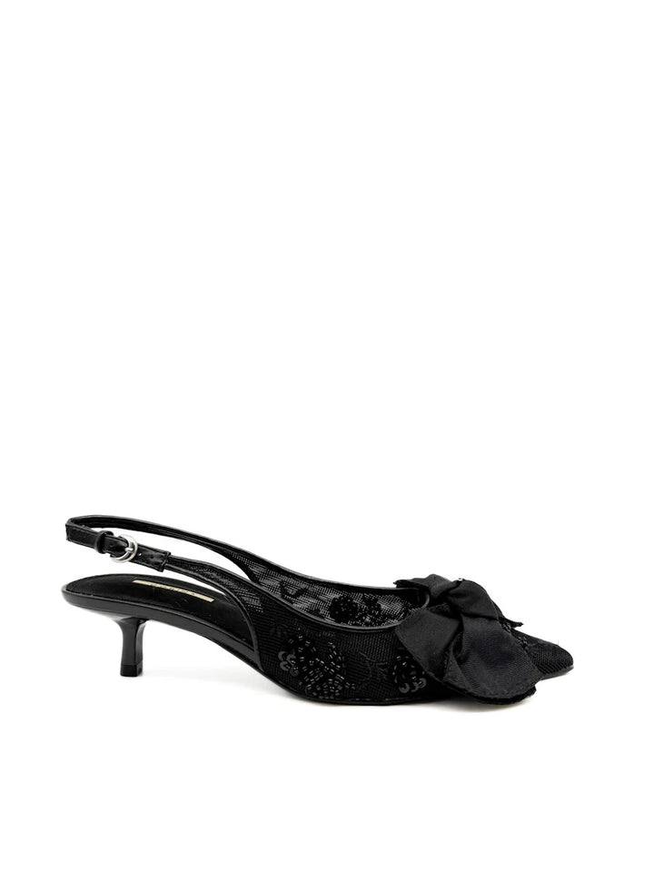 Zapatos Corina negros destalonado con lazo y rejilla